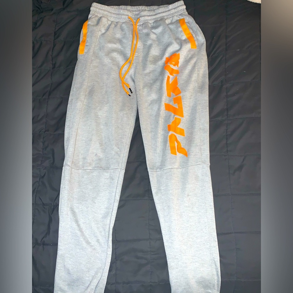grey and orange sweatpants